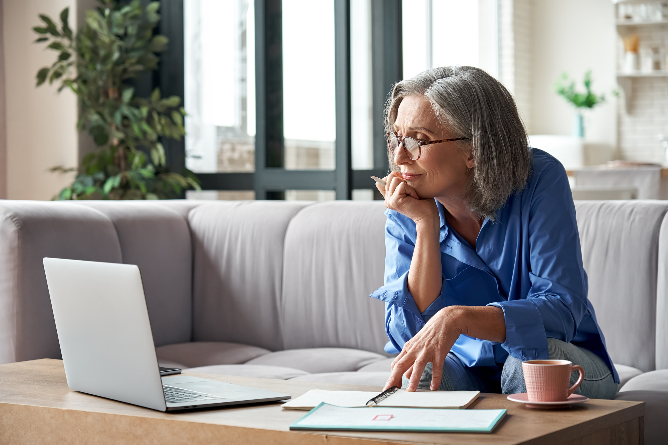 Old Woman Watching Webinar on Laptop 